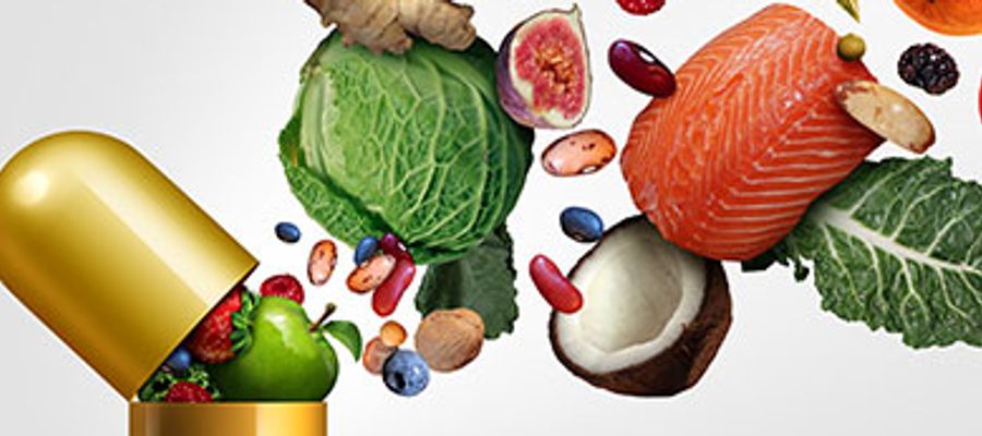 Stilisierte Darstellung wie Nahrung in eine Pille kommt